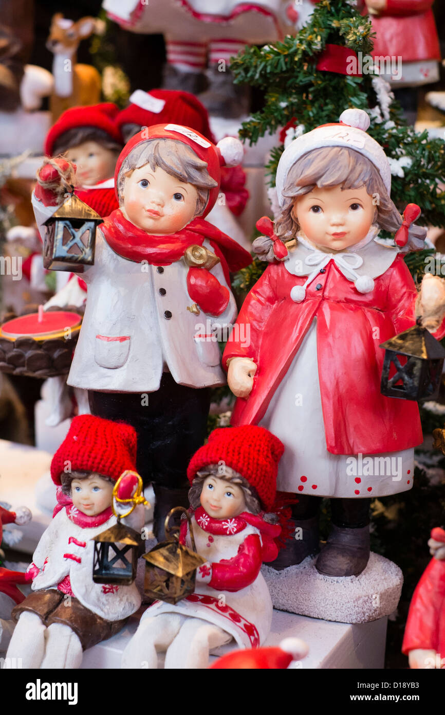 Traditional carved wooden seasonal ornaments for sale on stall at