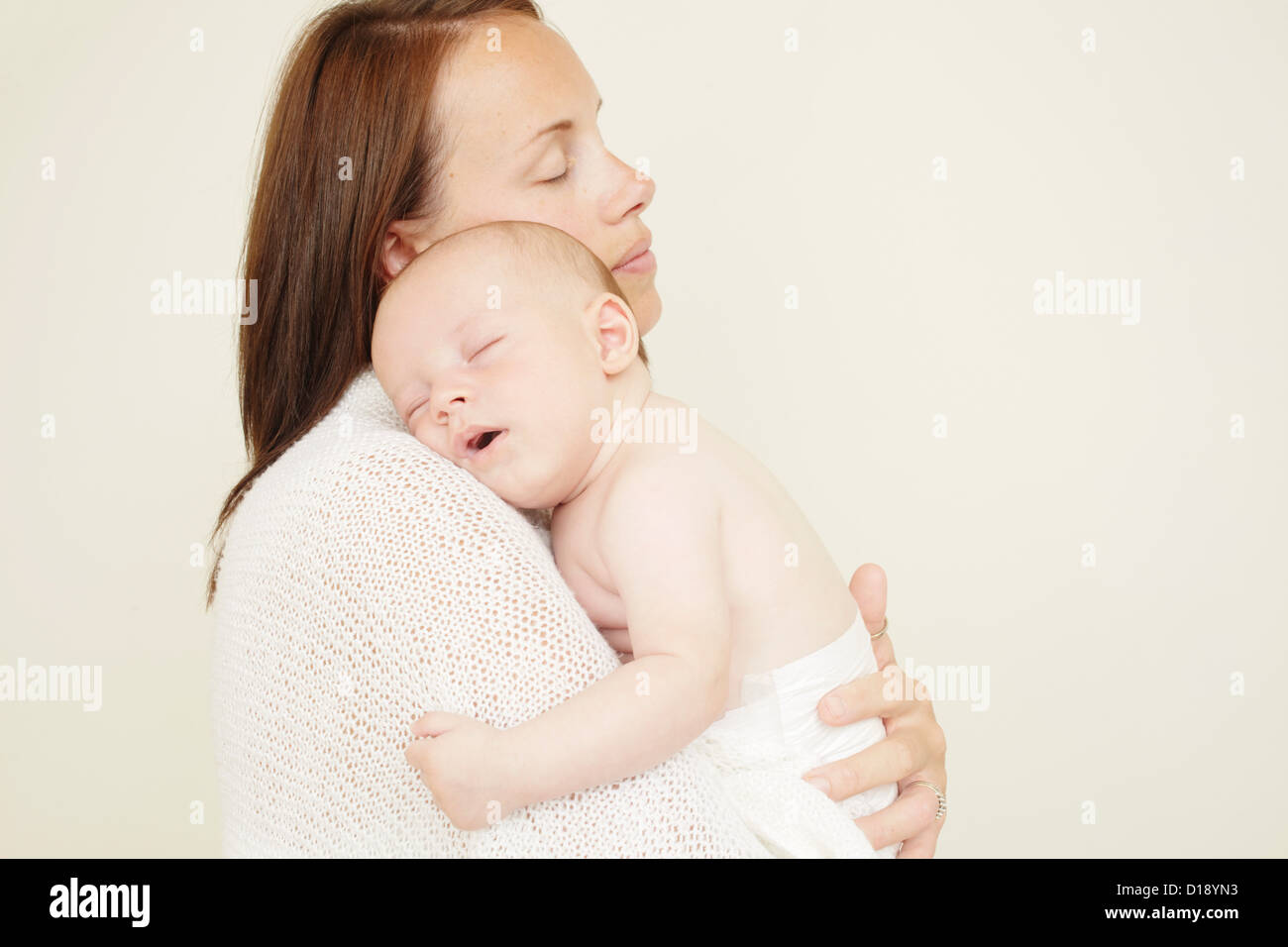 Mother with newborn baby sleeping on shoulder Stock Photo Alamy