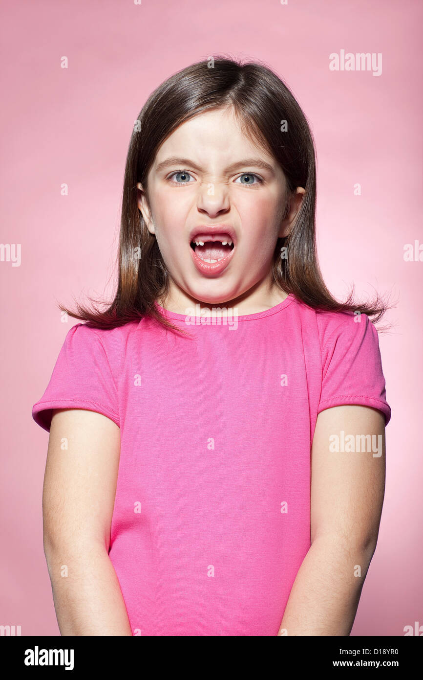 Girl pulling faces Stock Photo Alamy