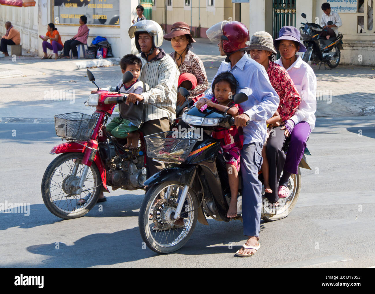 Overloaded Mopeds in Phnom Penh, Cambodia Stock Photo - Alamy