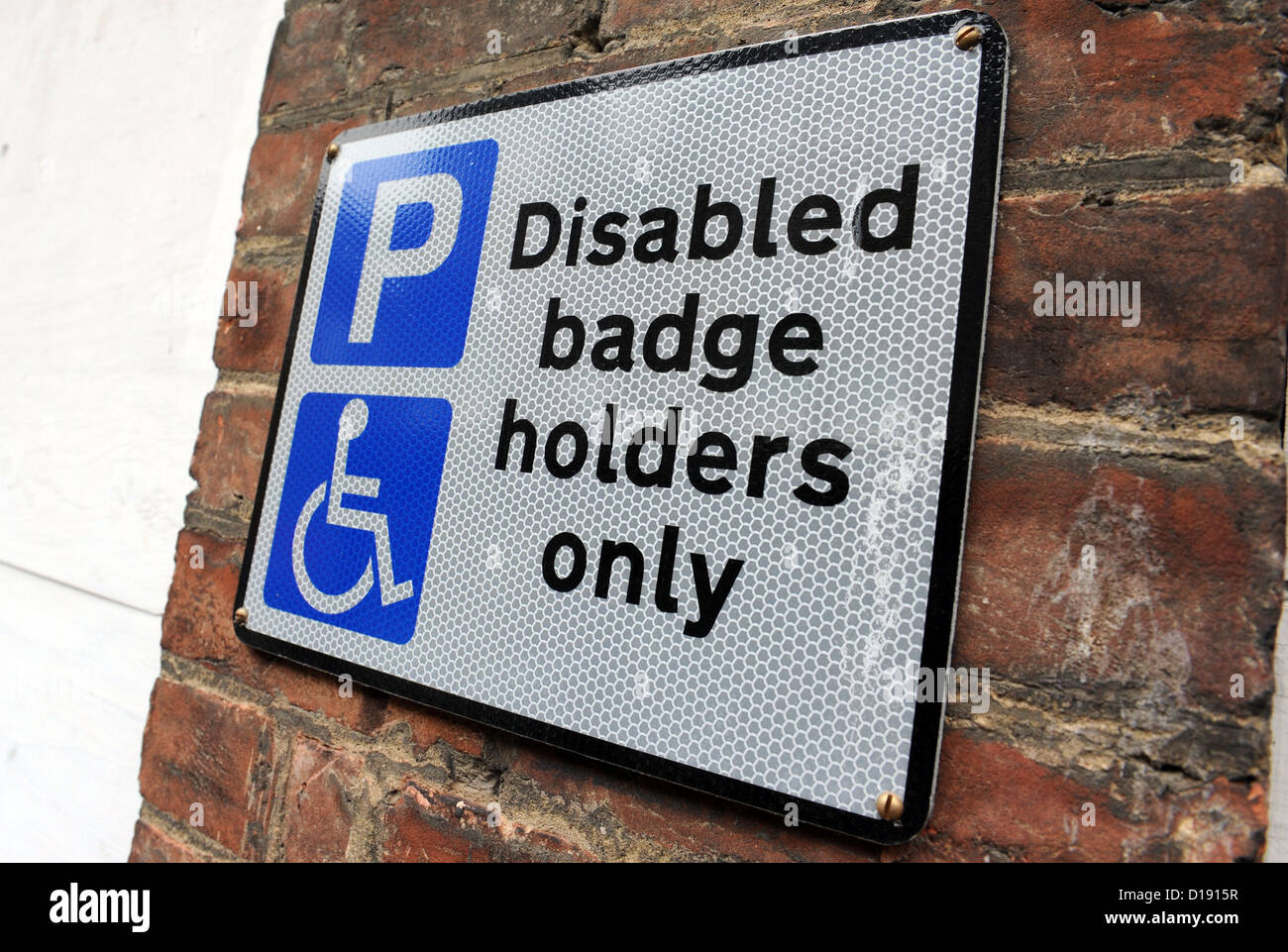 disabled badge holders only street parking restriction sign Stock Photo