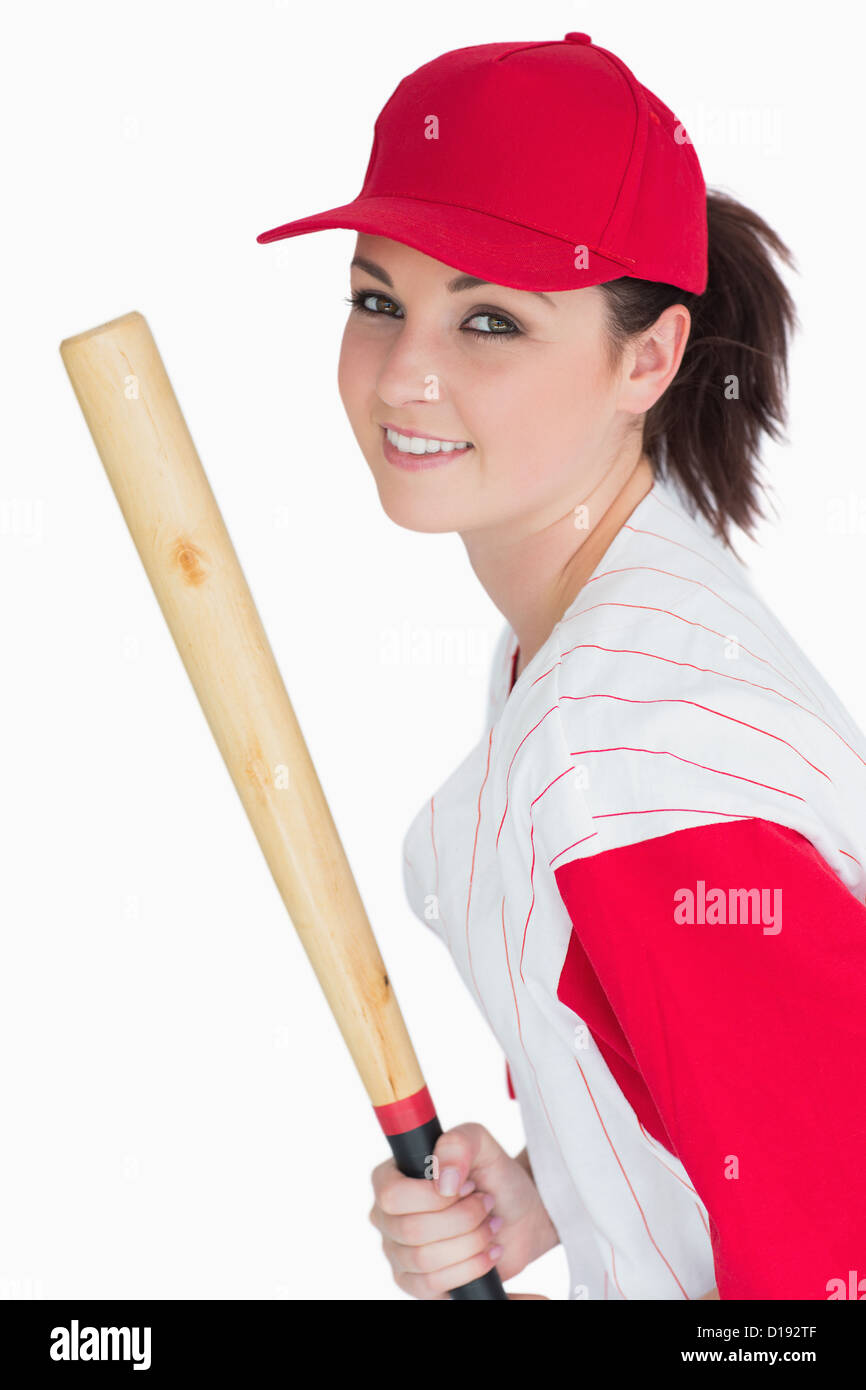 Smiling woman with baseball bat and hat Stock Photo Alamy