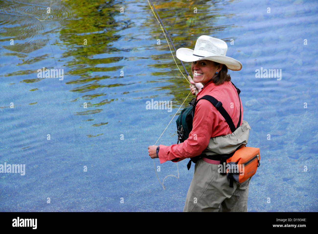 Woman fly fishing in the Lostine River, Northeast Oregon Stock Photo