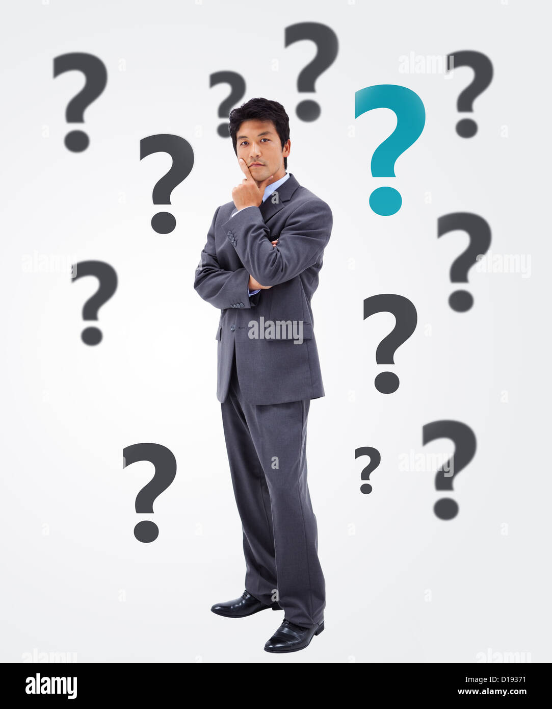 Businessman thinking on question mark background Stock Photo