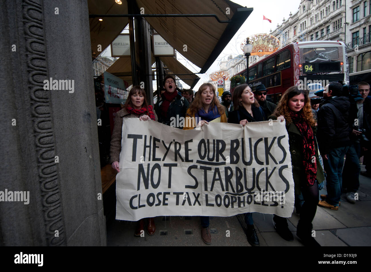 UK Uncut flashmob walk down Regent Street , London, to draw attention to Starbucks and their tax evasion. Stock Photo
