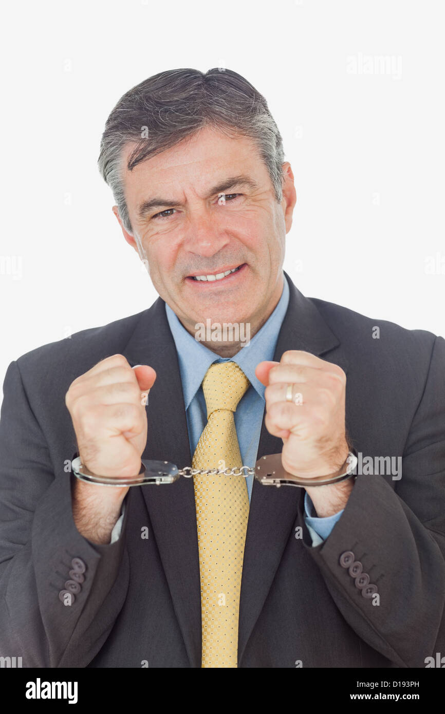 Businessman with handcuffed hands Stock Photo Alamy