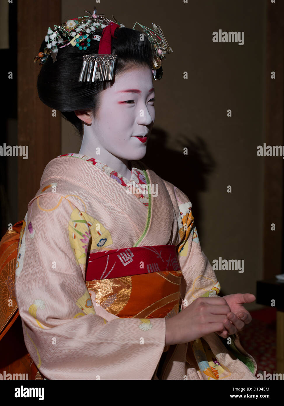 Eriha at 17 year old maiko ( trainee geisha ) entertaining guests in a Gion teahouse in Kyoto, Japan Stock Photo