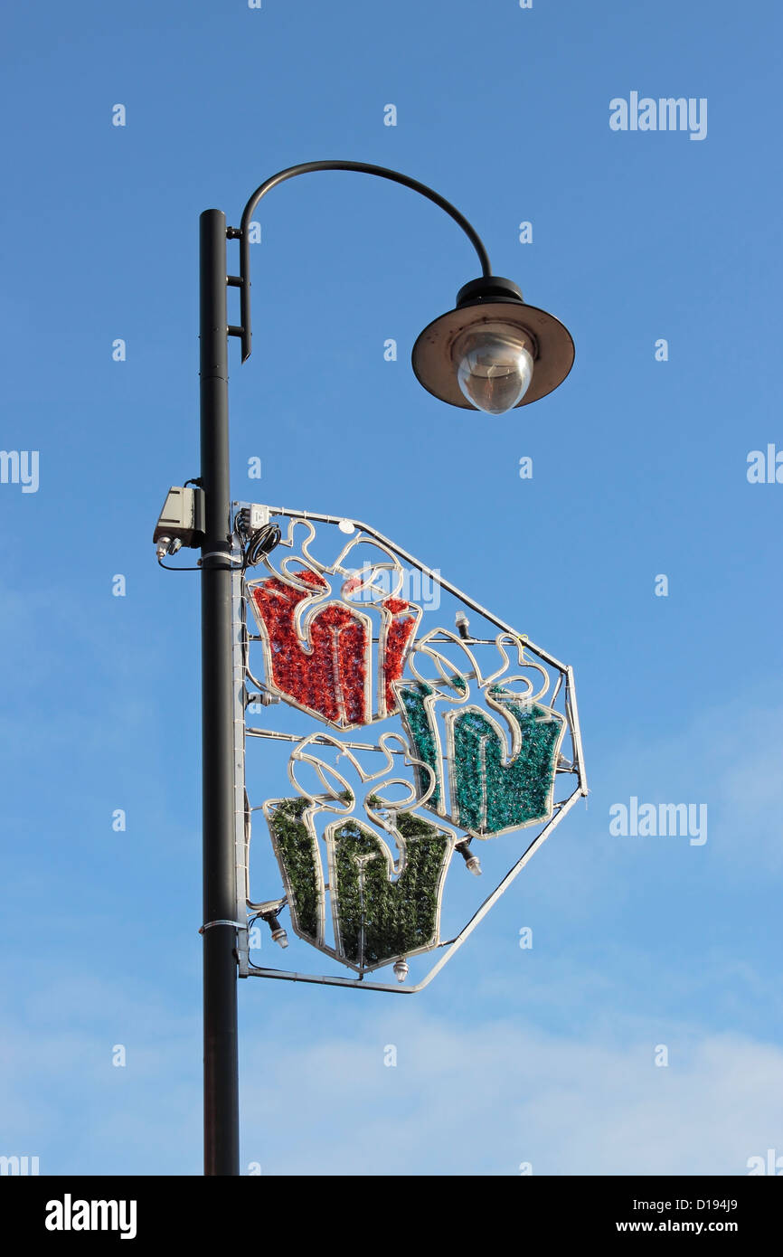 Street Light in Selby with Christmas Lights Fitted against clear blue sky Stock Photo