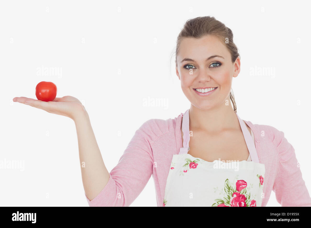 Woman holding tomato Stock Photo - Alamy