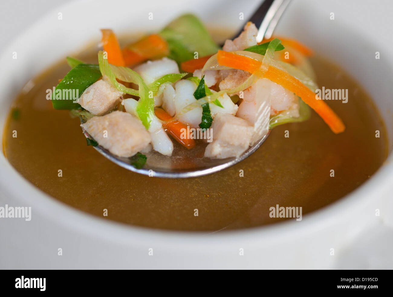 Rustic indonesian chicken soup in a small bowl Stock Photo
