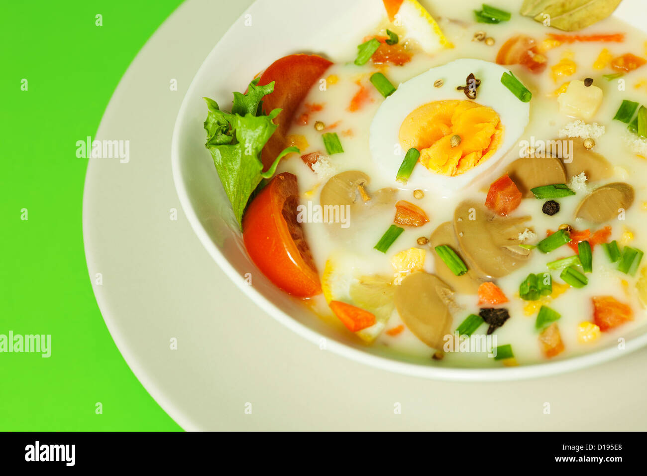 Bowl of delicious mushroom cream soup on the plate Stock Photo