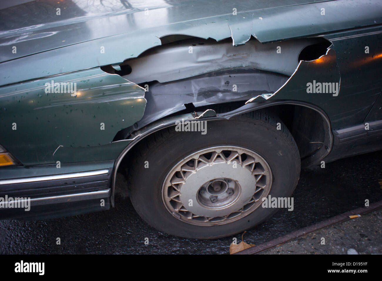 Automobile involved in a minor fenderbender collision is seen parked