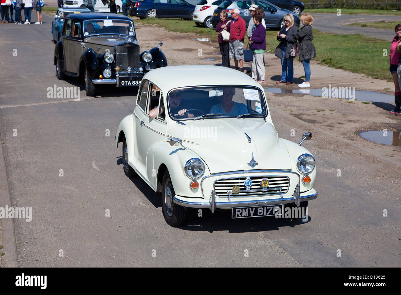 Classic cars leave Cromer cliff top car park for Great Yarmouth Stock Photo Alamy