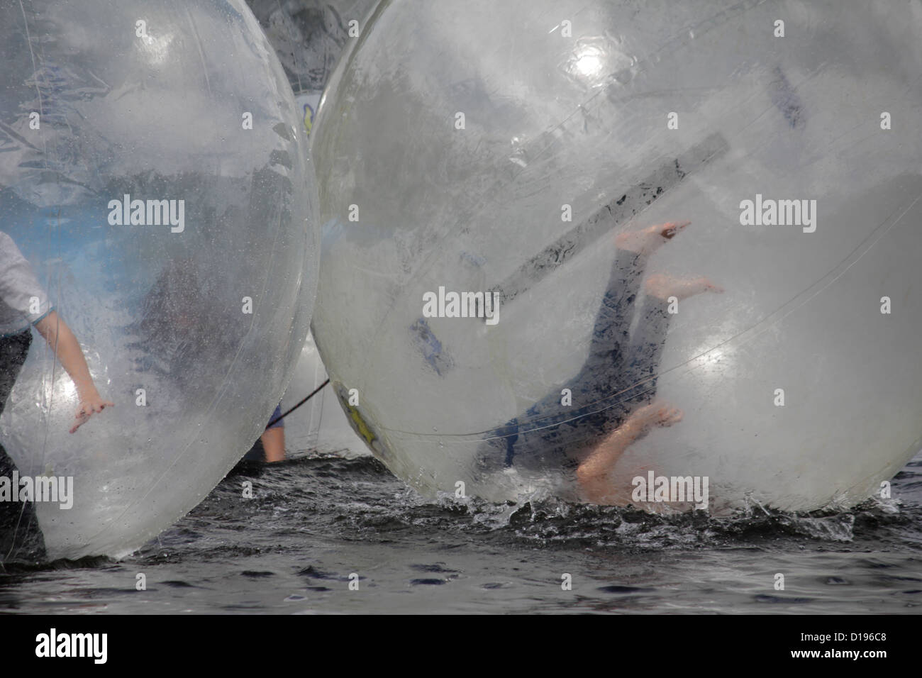 children in zorb ball on lake padarn in llanberis, wales, great britain, uk Stock Photo