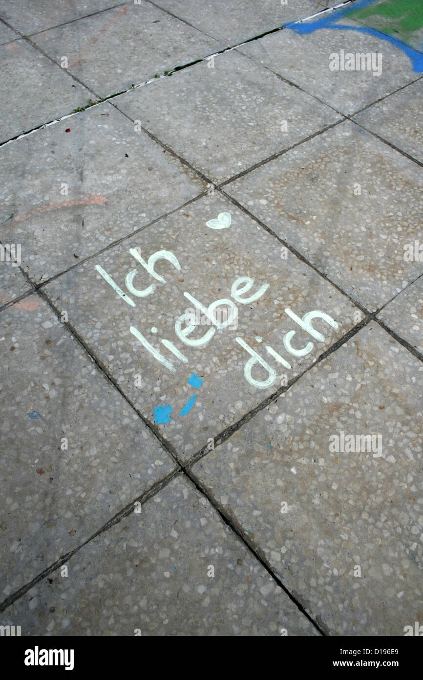 ich liebe dich graffiti written on pavement sidewalk Stock Photo Alamy