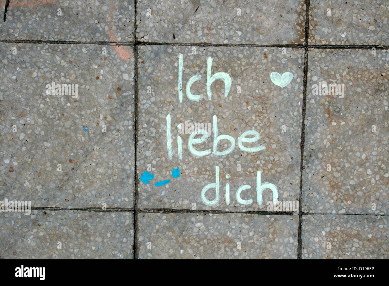 ich liebe dich graffiti written on pavement sidewalk Stock Photo Alamy