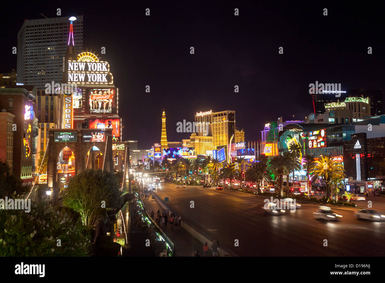 People walking at nighttime on Las Vegas Blvd. in Las Vegas, Nevada. Stock Photo