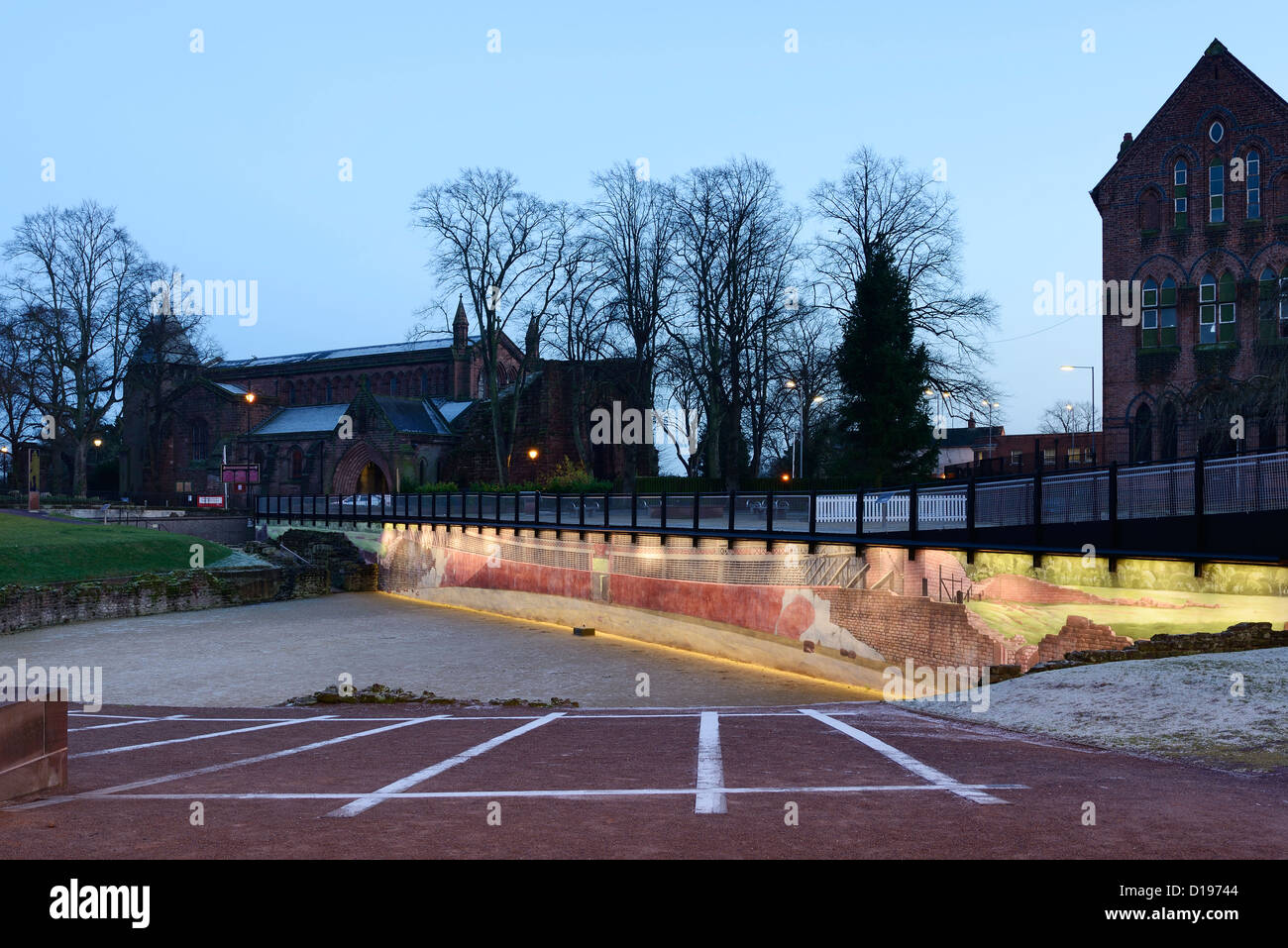 The Roman Amphitheatre in Chester with a mural showing the other half that has not yet been excavated. Stock Photo