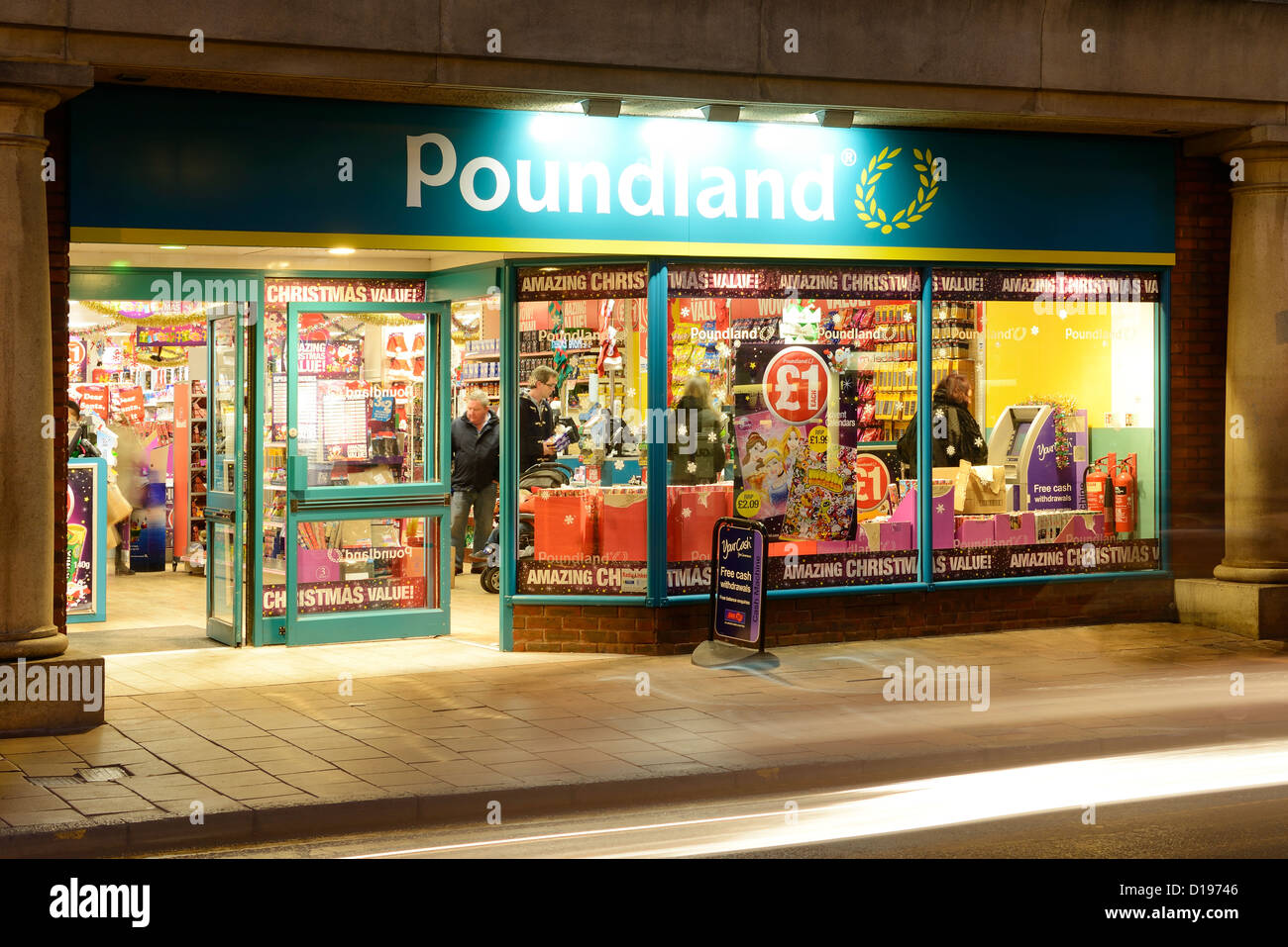 Poundland shop front at night Stock Photo