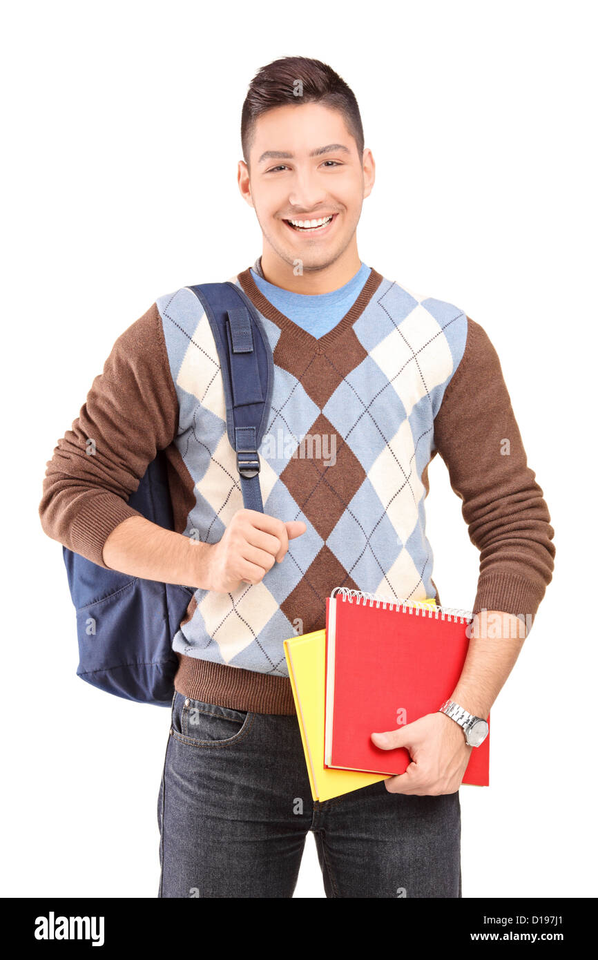 A handsome male student school bag holding books isolated against white