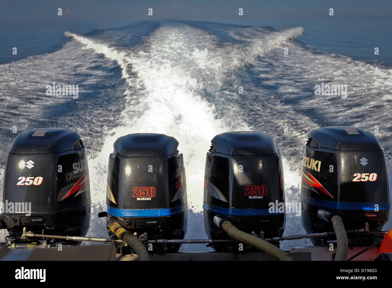 Four 250hp outboards power an inter island ferry, Indonesia Stock Photo