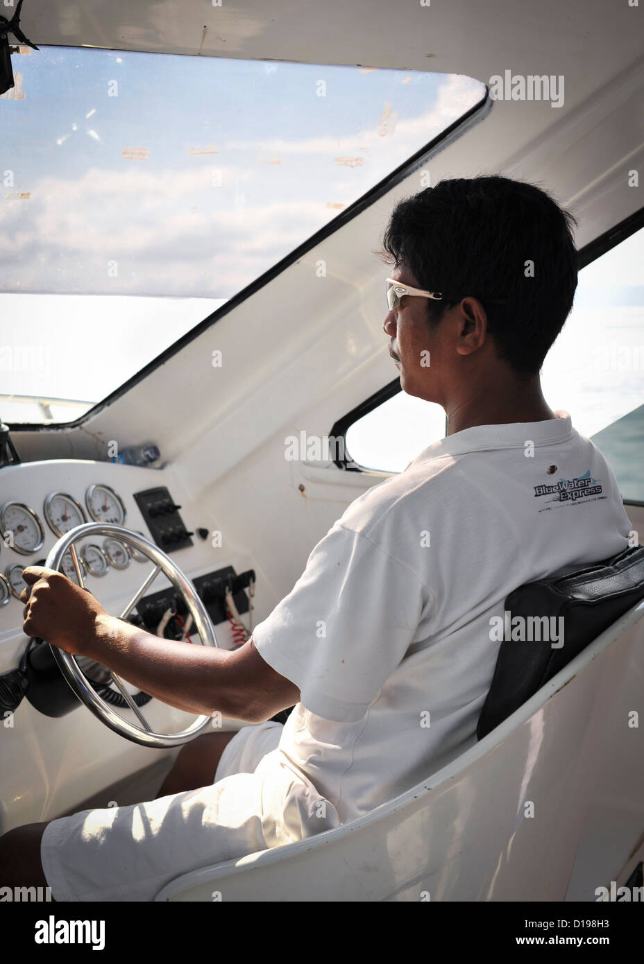 The Captain drives an inter island ferry, Indonesia Stock Photo