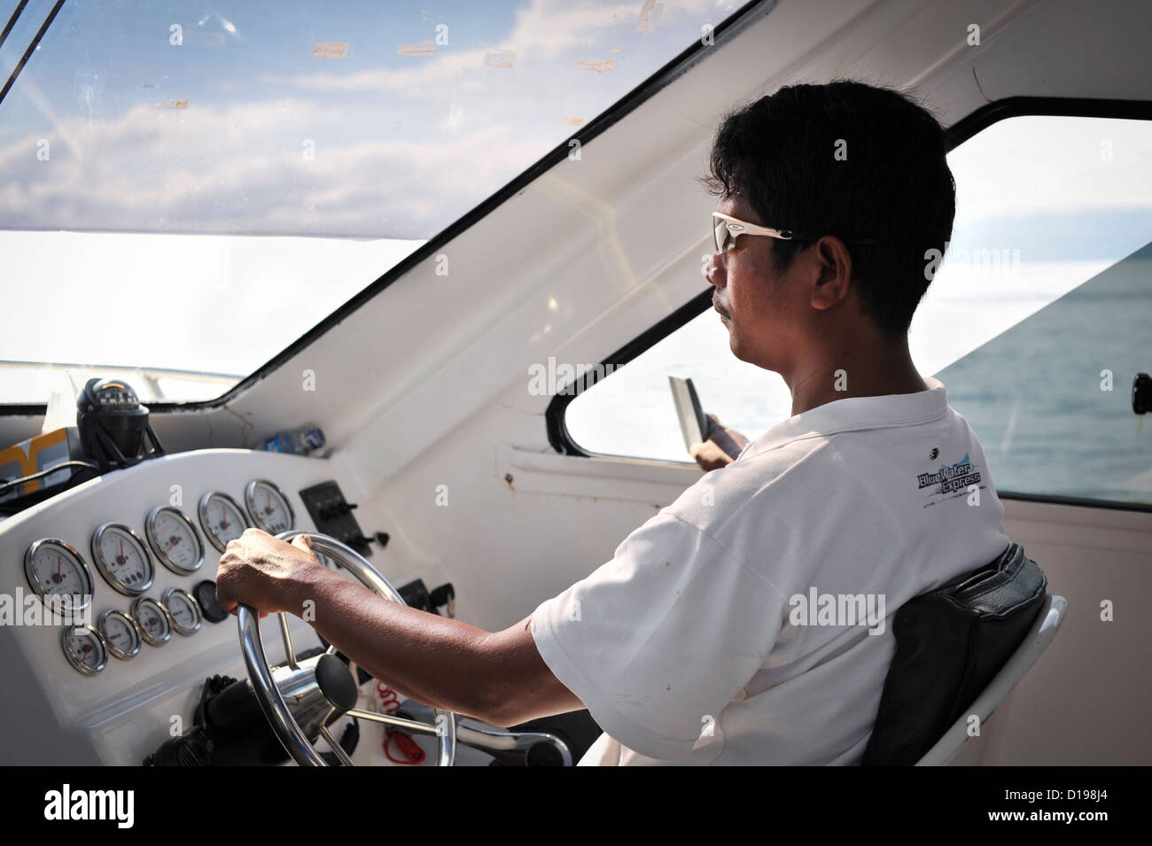 The Captain drives an inter island ferry, Indonesia Stock Photo
