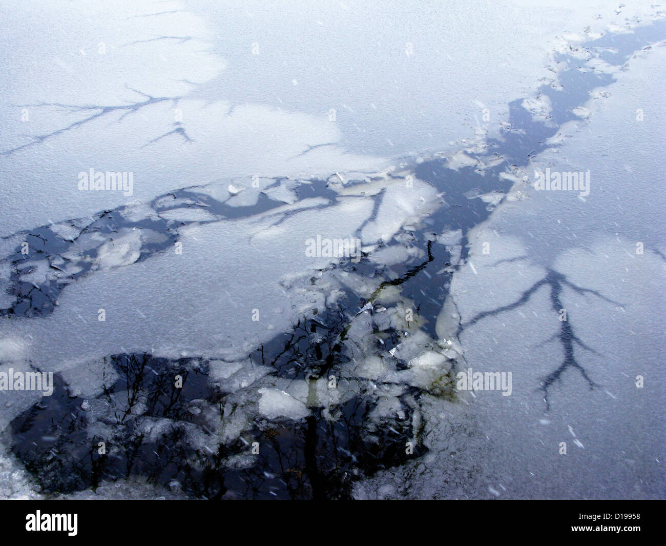 Pele In Ice, Rhode Island, Warren, Winter Snow Falling On Cracks In IceCovered Water Stock