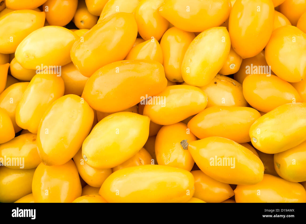 Yellow pear tomatoes on display at the market Stock Photo