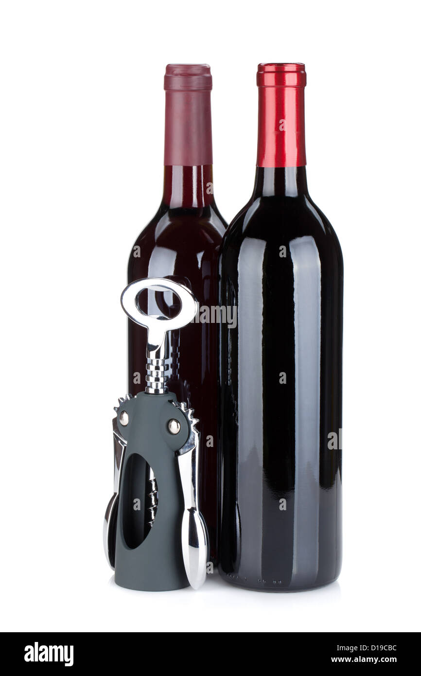 Two red wine bottles and corkscrew. Isolated on white background Stock