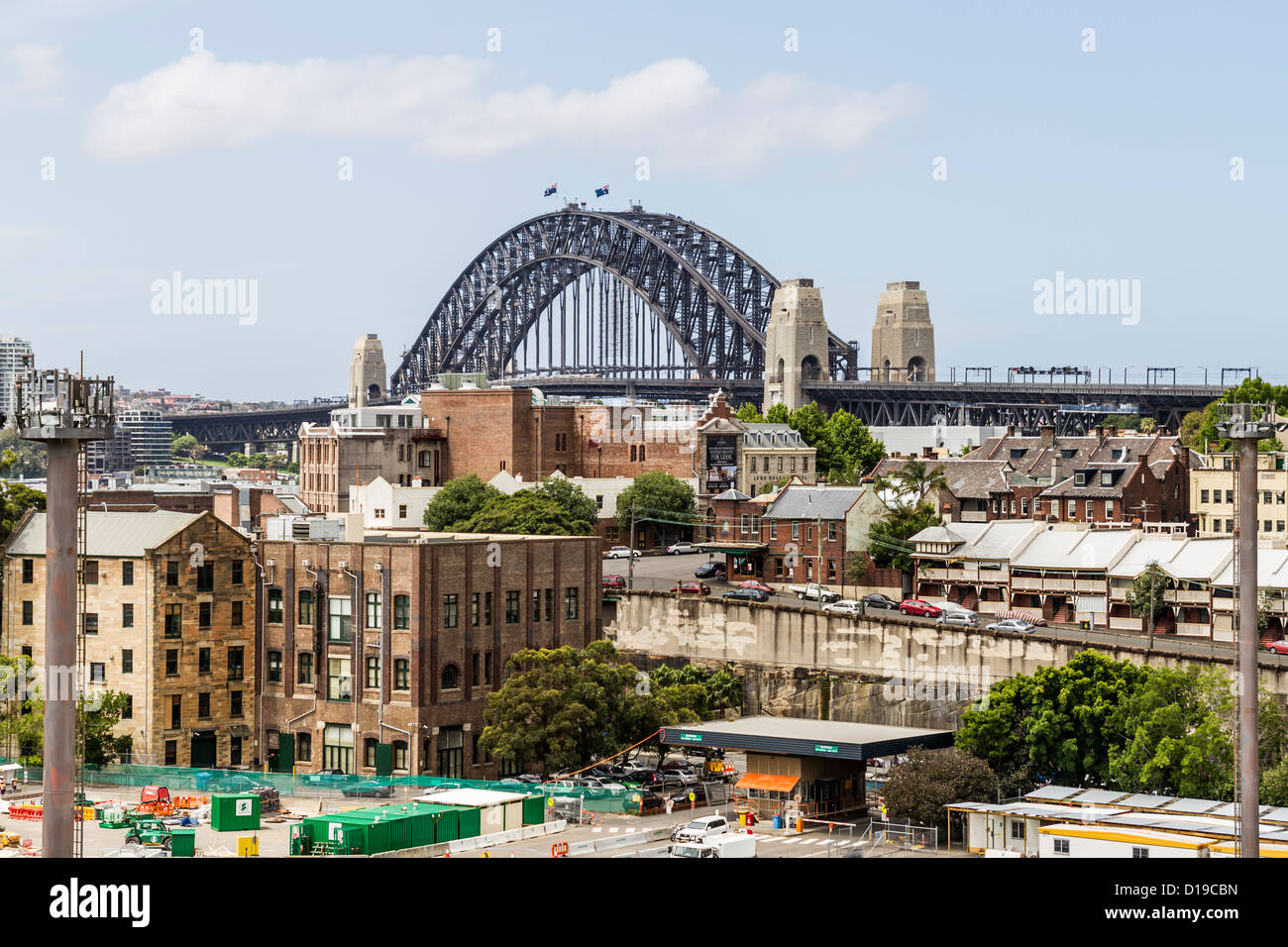 The Rocks, Sydney with new cruise ship terminal under construction in foreground and Sydney Harbour Bridge in background. Stock Photo