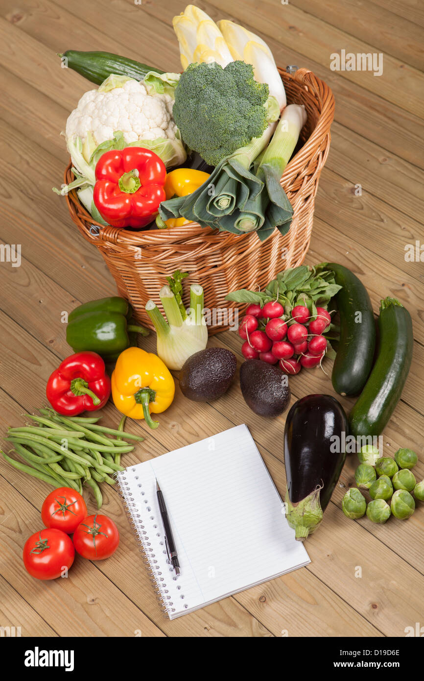 Book with vegetables and basket Stock Photo