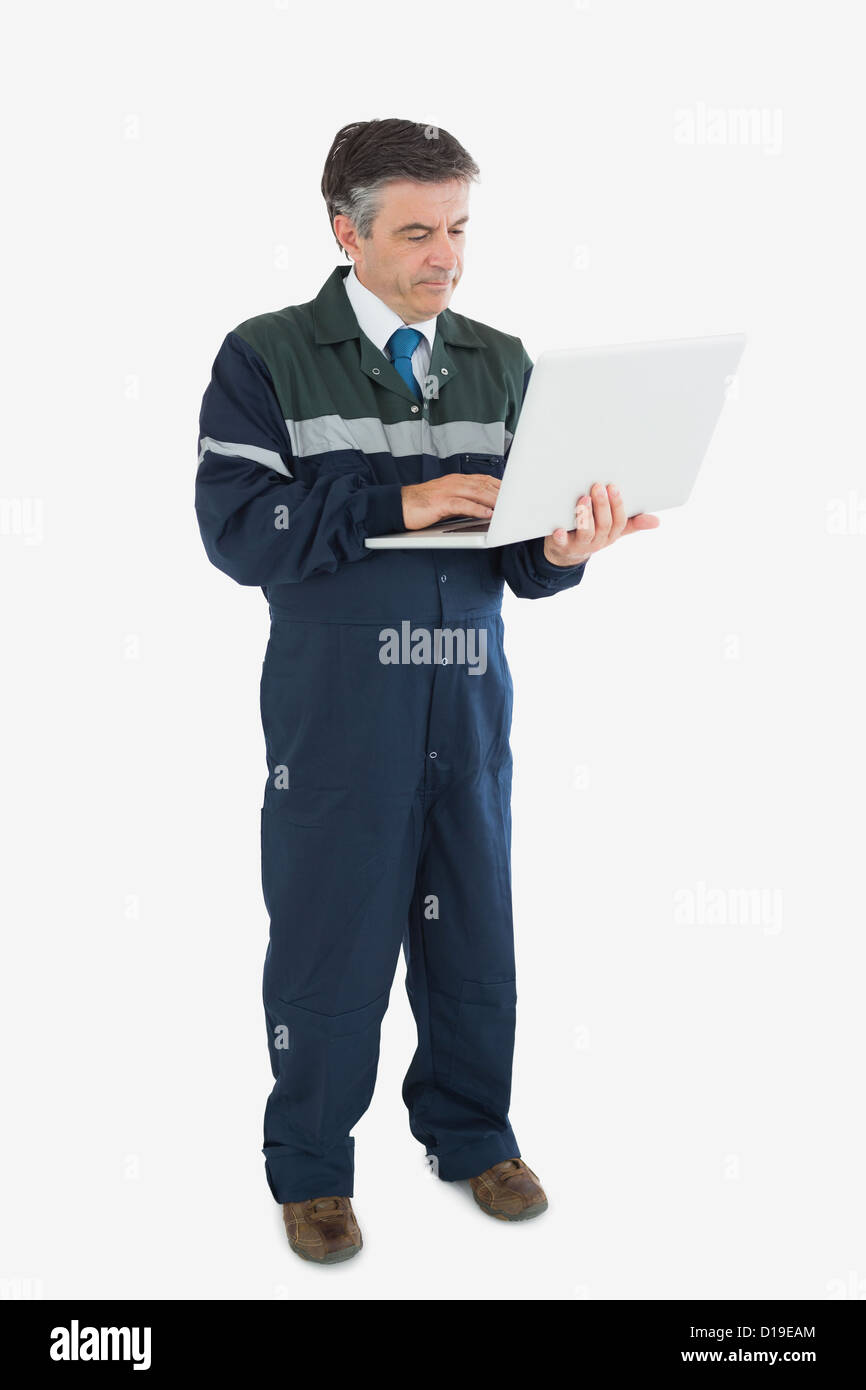 Repairman using laptop Stock Photo