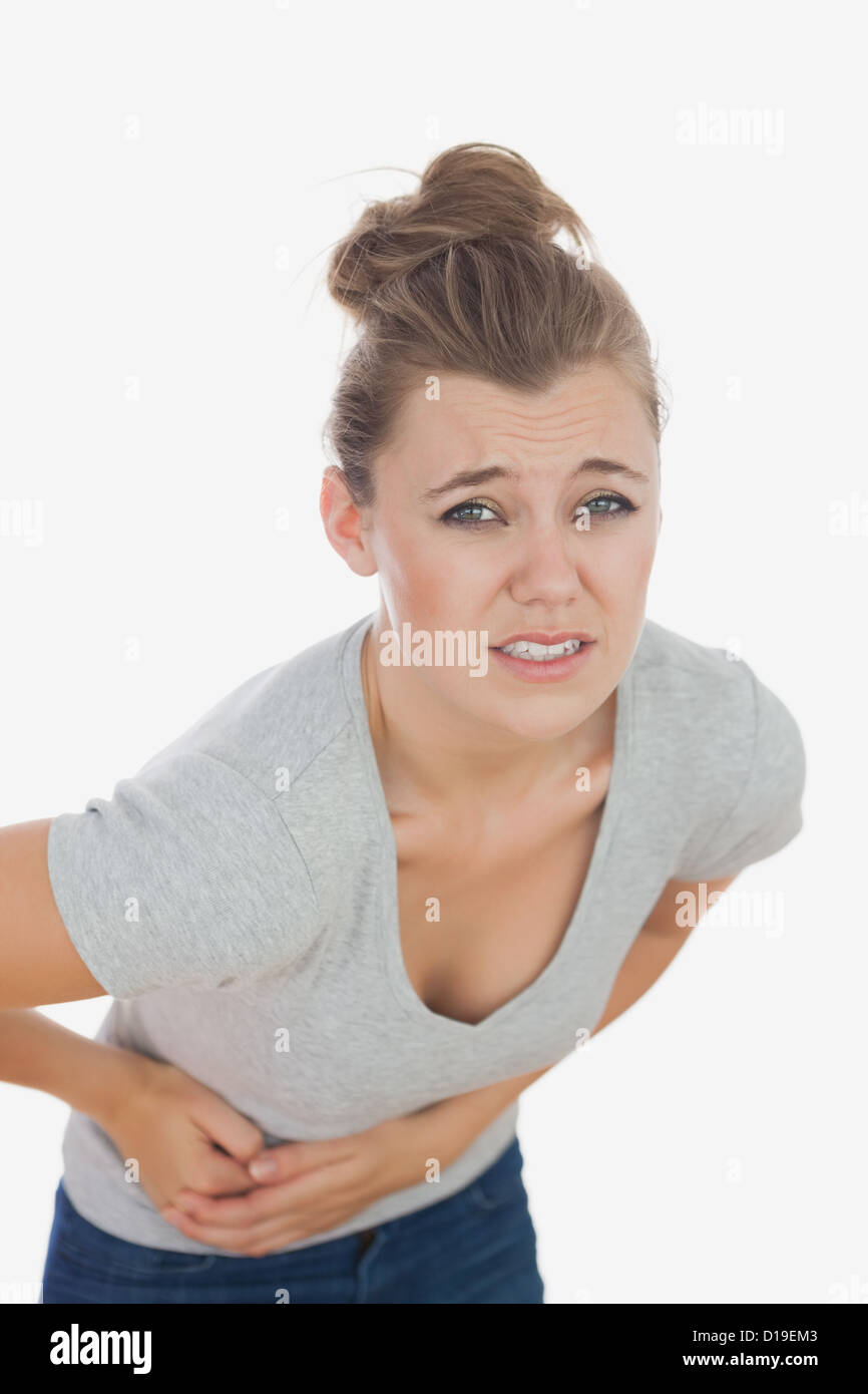 Young woman suffering from stomach pain Stock Photo Alamy