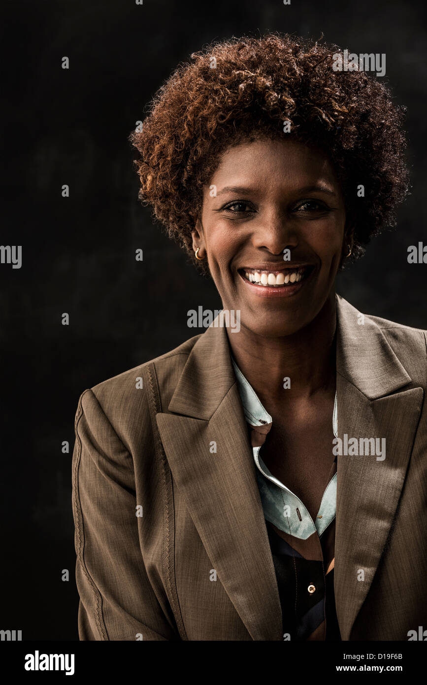 Portrait of businesswoman wearing brown jacket Stock Photo