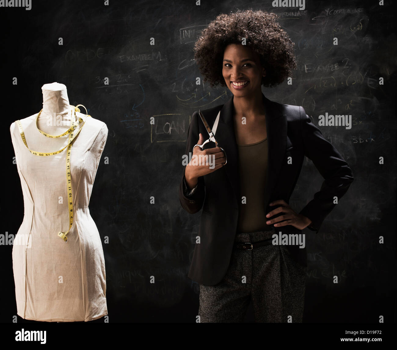 Businesswoman with tailors dummy and scissors Stock Photo