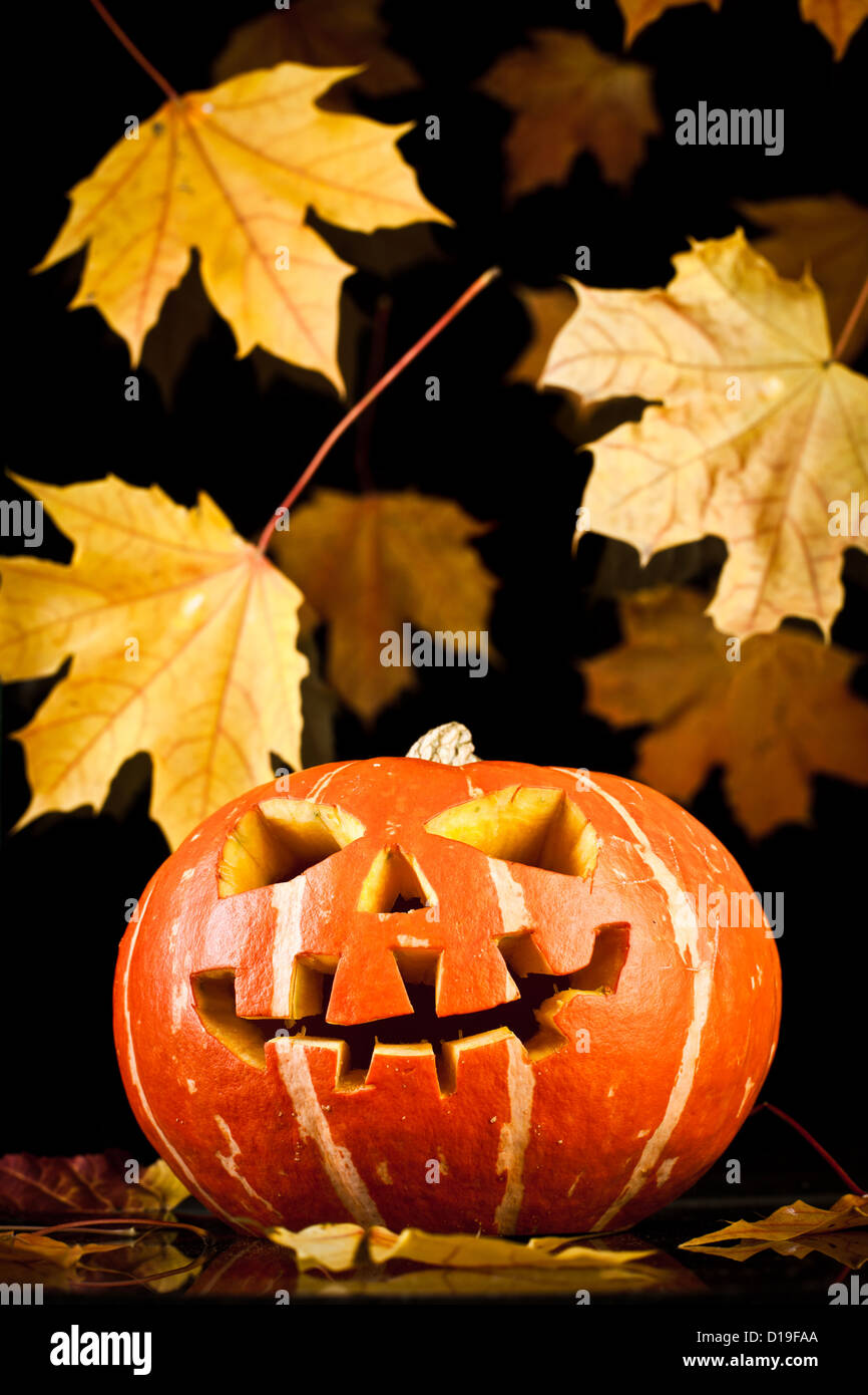 Scary old jack-o-lantern on black background Stock Photo - Alamy