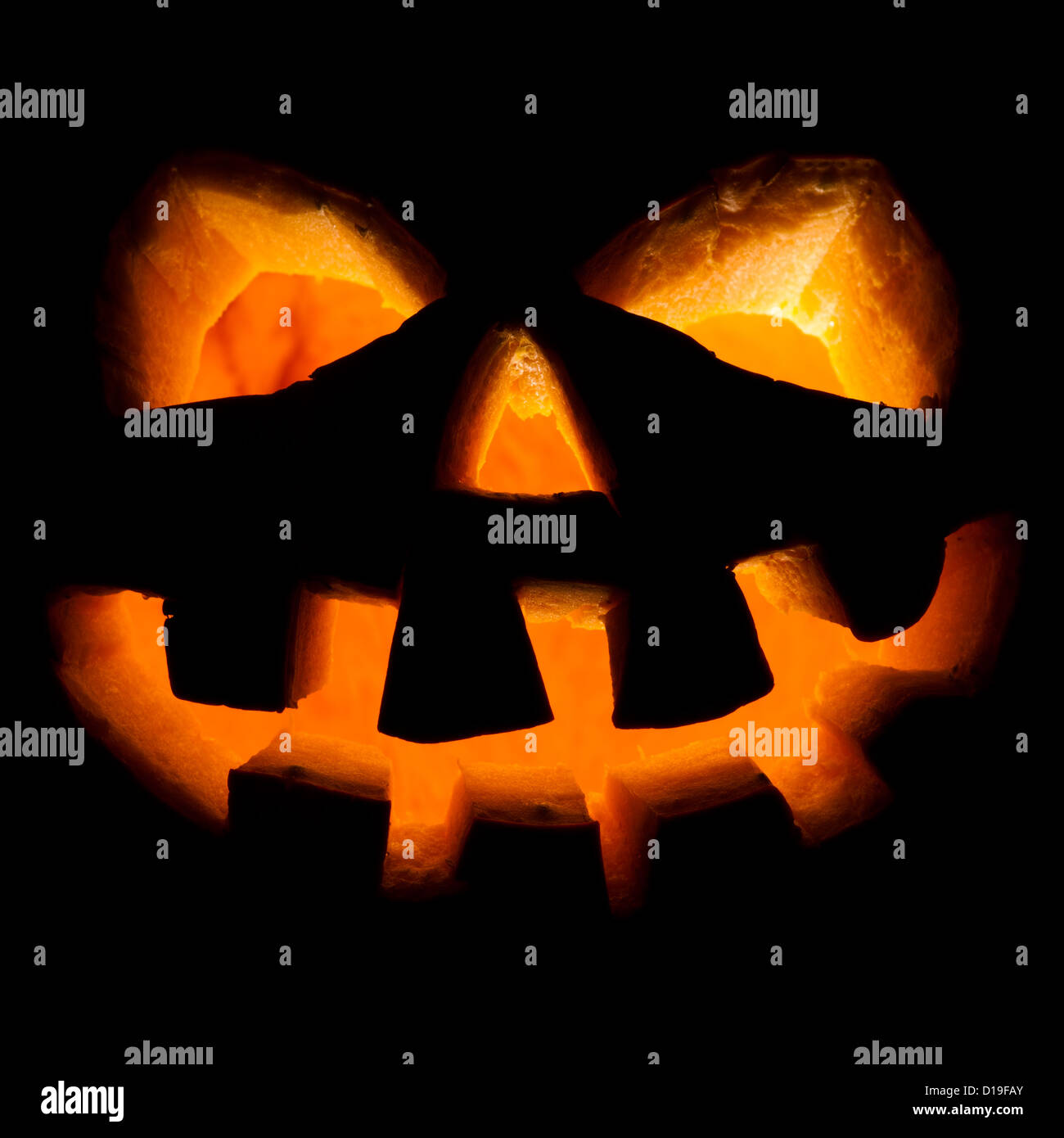 Scary old jack-o-lantern on black background Stock Photo - Alamy