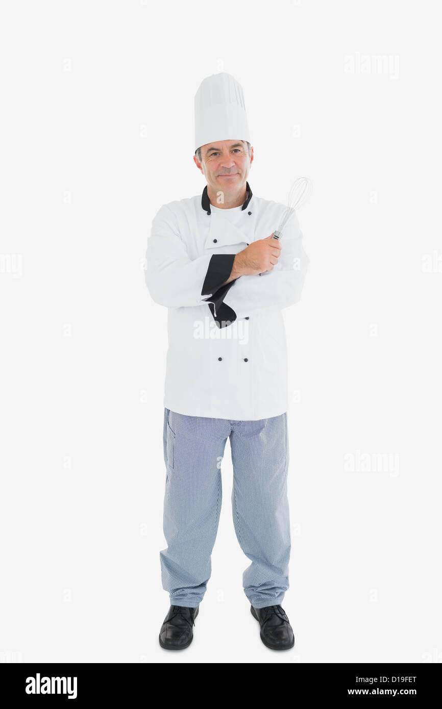 Male chef holding wire whisk Stock Photo