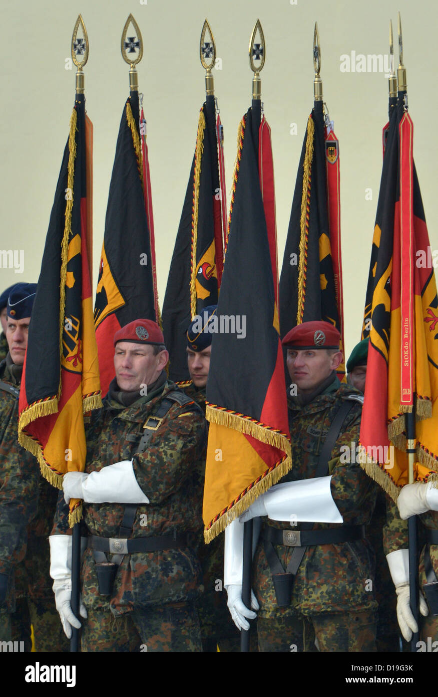 Flag carrying German Armed Forces soldiers report for a fairwell muster in Erfurt, Germany, 11 December 2012. There was a farewell ceremony for the Military Subdistrict Comand III that has been stationed in Erfurt for approximately eleven years. It will be disbanded by the end of March 2013. Photo: Martin Schutt Stock Photo