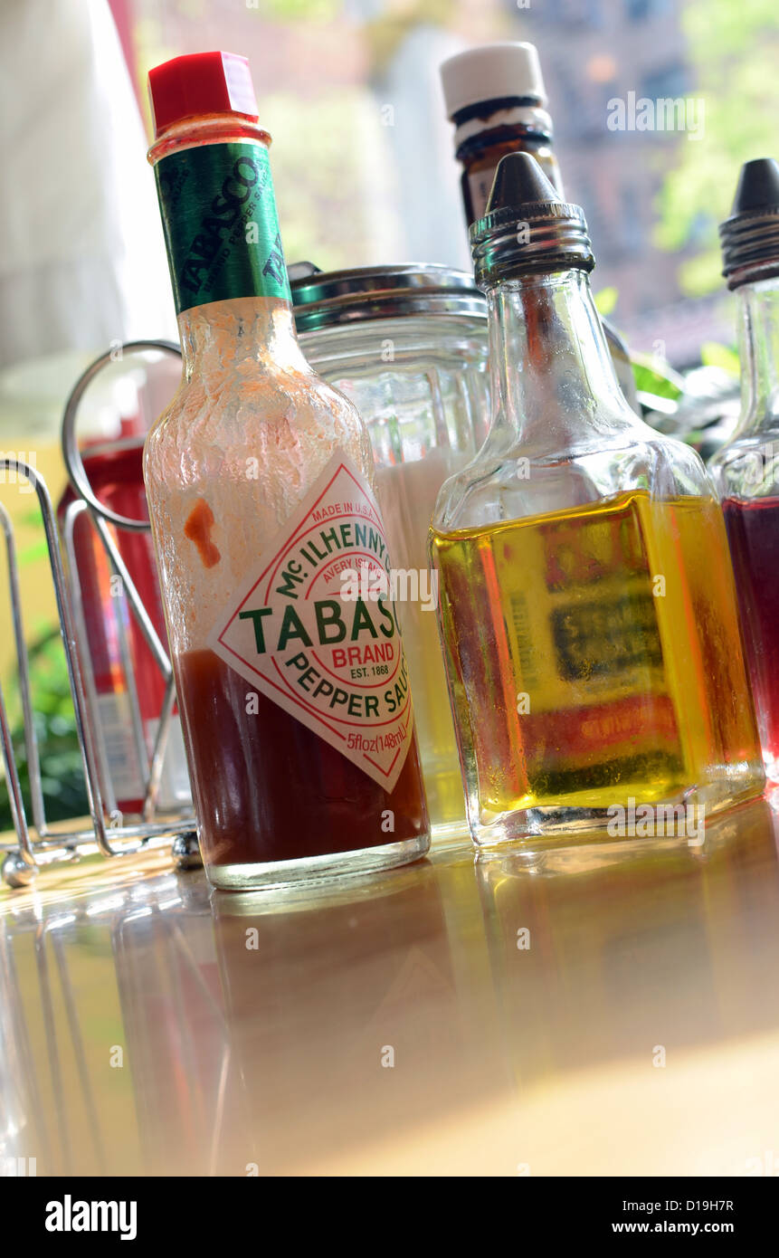 Tabasco, Olive oil and spices on table, in Colombian Restaurant at