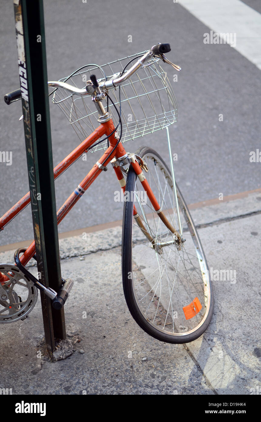 Parked bicycle with bent wheel Stock Photo Alamy
