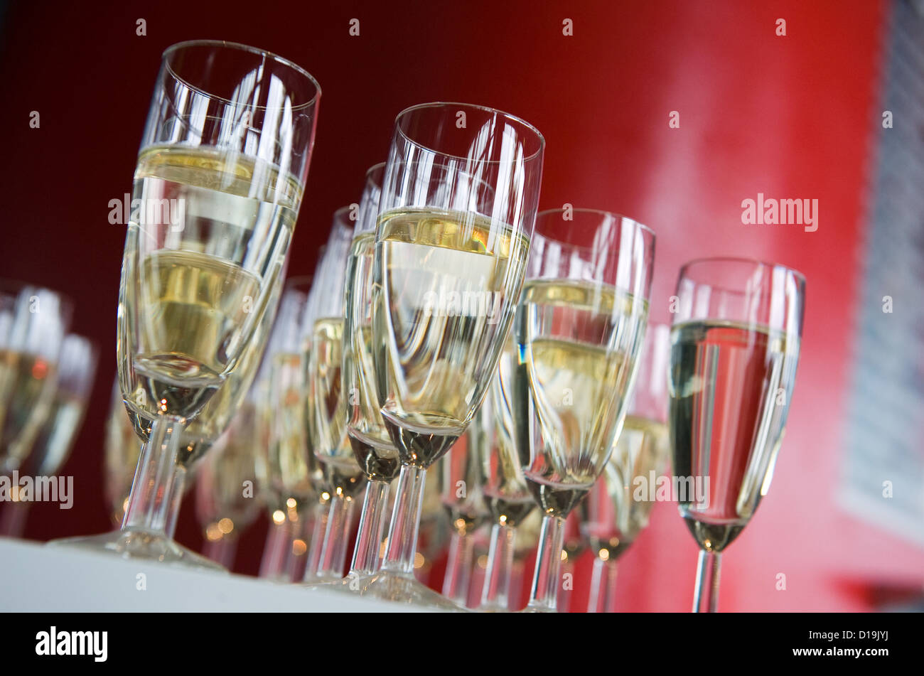 Filled glasses of champagne on a table Stock Photo