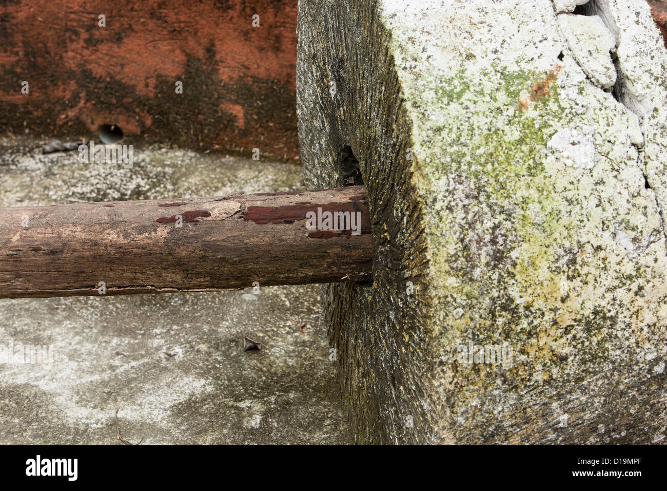 A grinding stone used in the distilling process of tequila. Shows axle