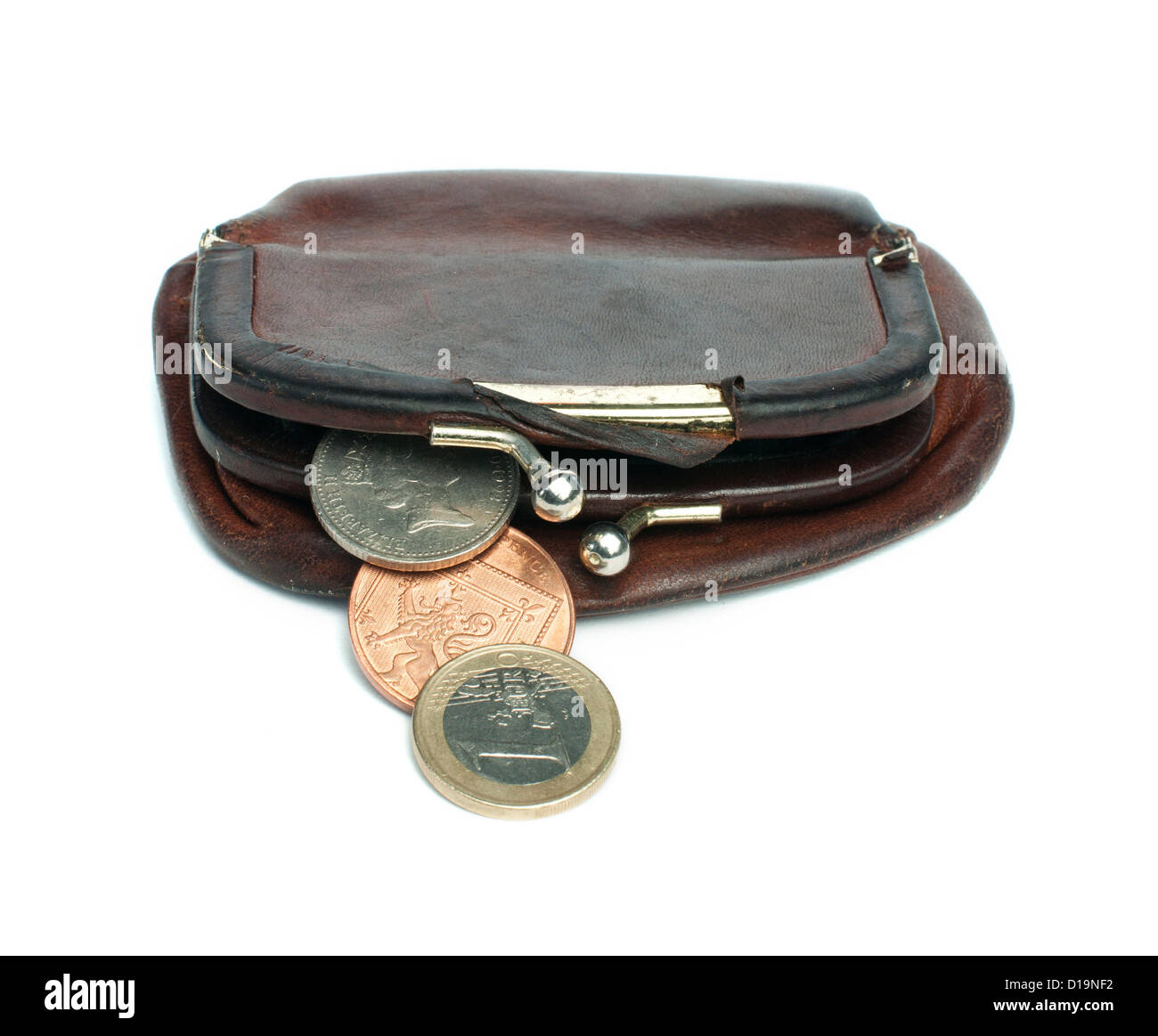 Old ladies brown leather purse on white background. Coins out of it Stock Photo