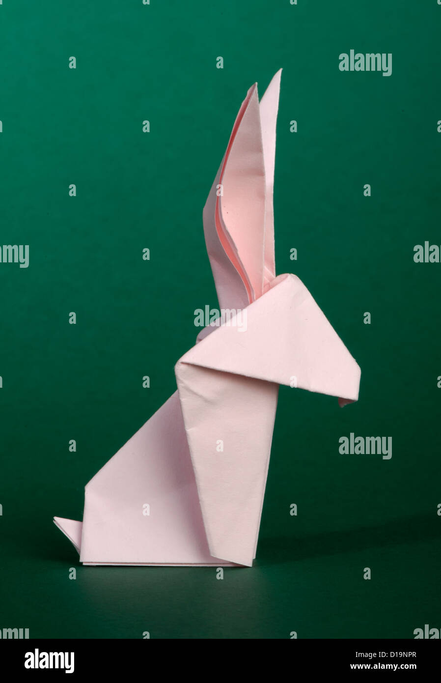 Paper made pink rabbit. 3D folded origami style Stock Photo - Alamy