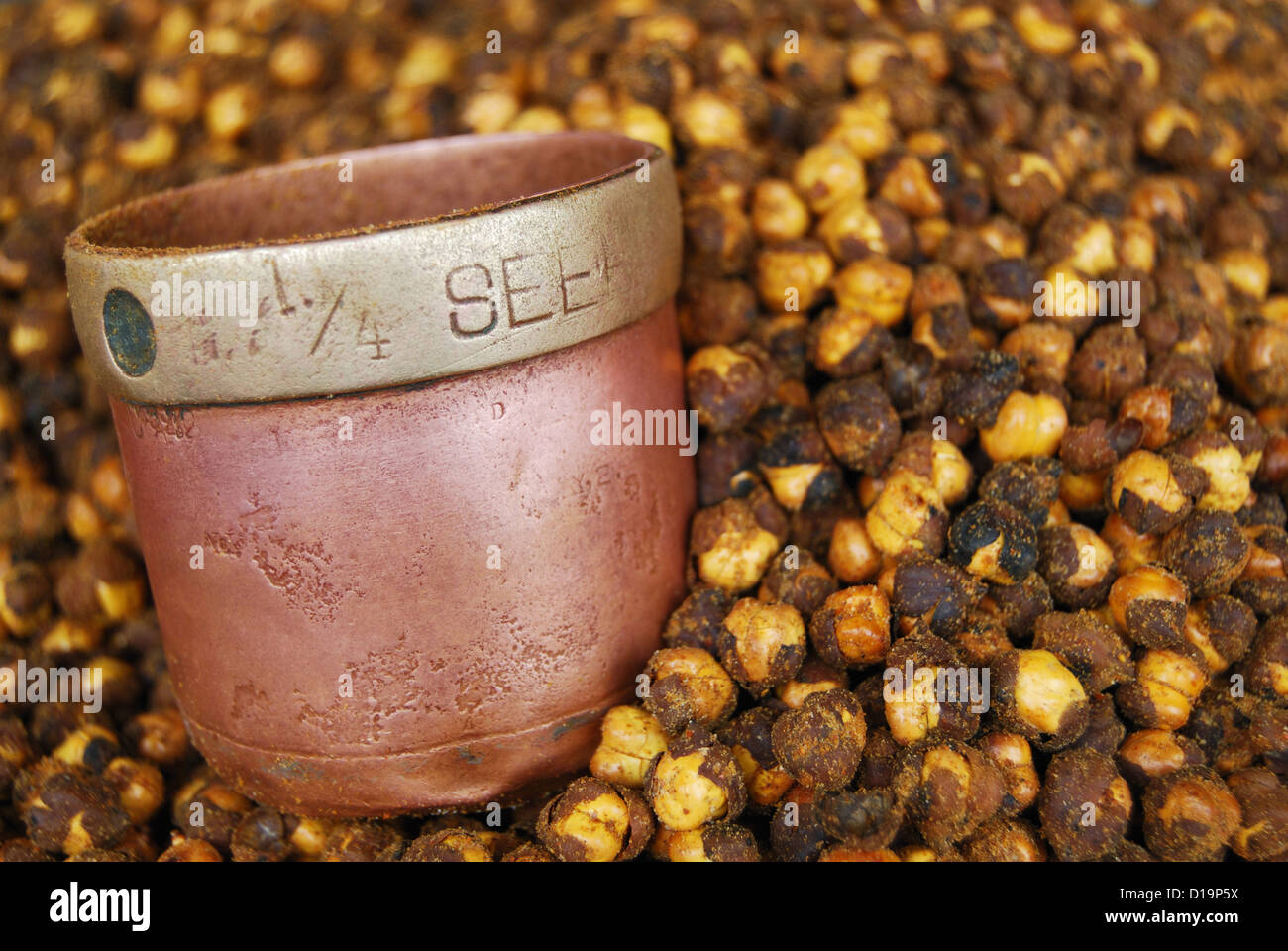 A old measure of brass and gram ( chana ) Stock Photo
