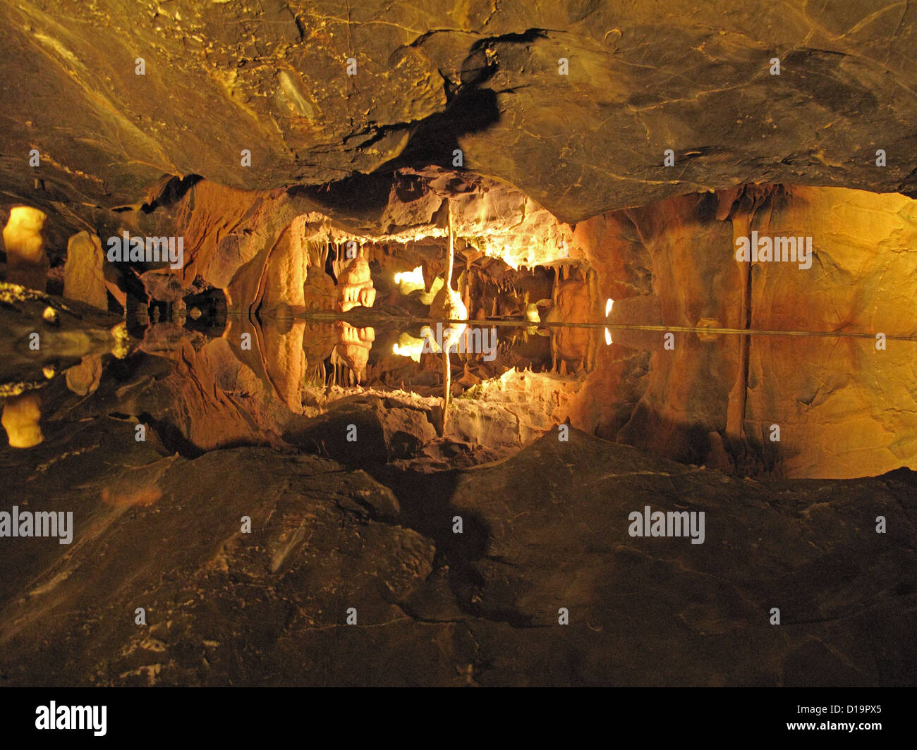 Still pool of water reflecting detail in the limestone caves of Cheddar Gorge Stock Photo