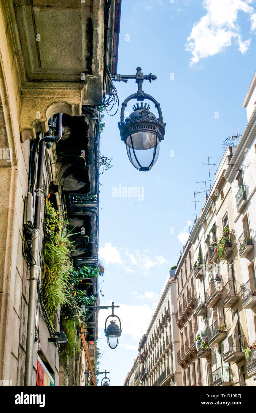 Lovely building lights hang from the front facade in the Barri Gotic district of Barcelona, Spain. Stock Photo