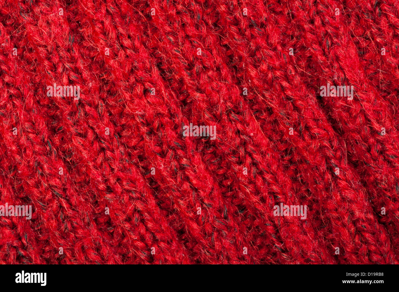Handmade knit red background. Close up structure of the yarn Stock Photo